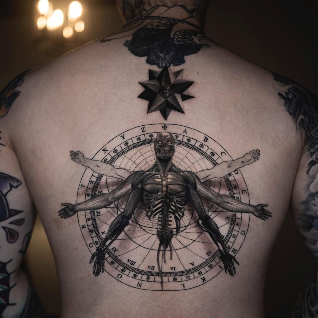 Intricate tattoo design featuring a human anatomy illustration.