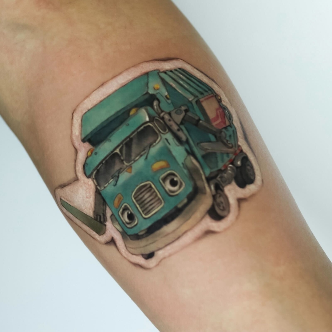 Colorful truck tattoo on a person's arm