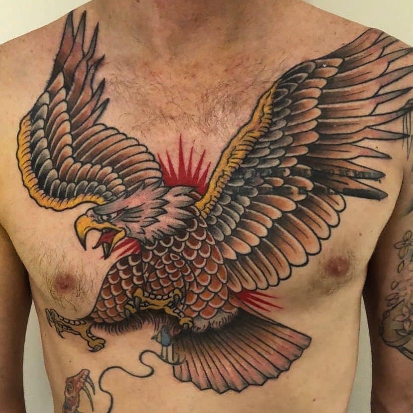 Tattoo of an eagle on a man's chest.