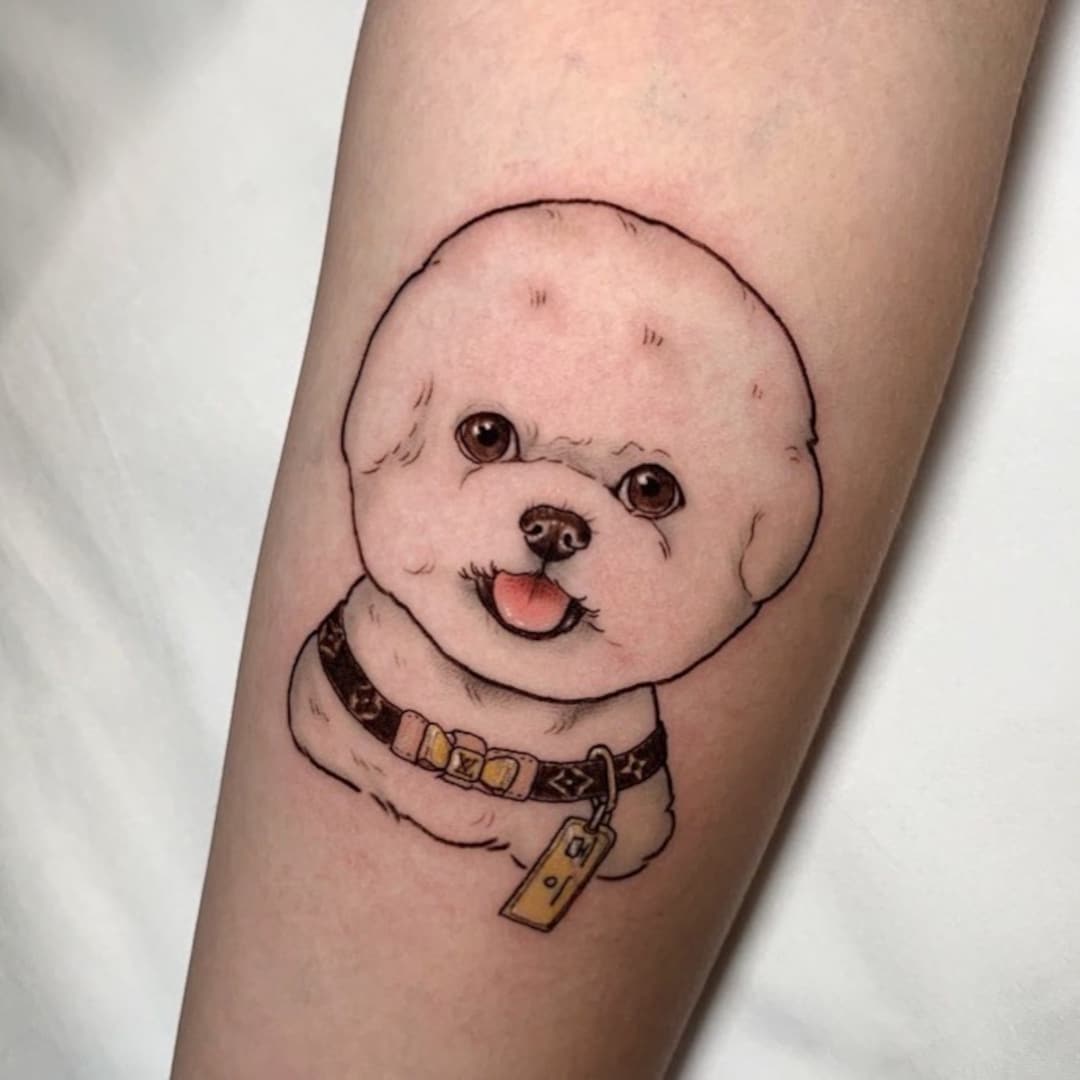 Tattoo of a Bichon Frise dog on a forearm