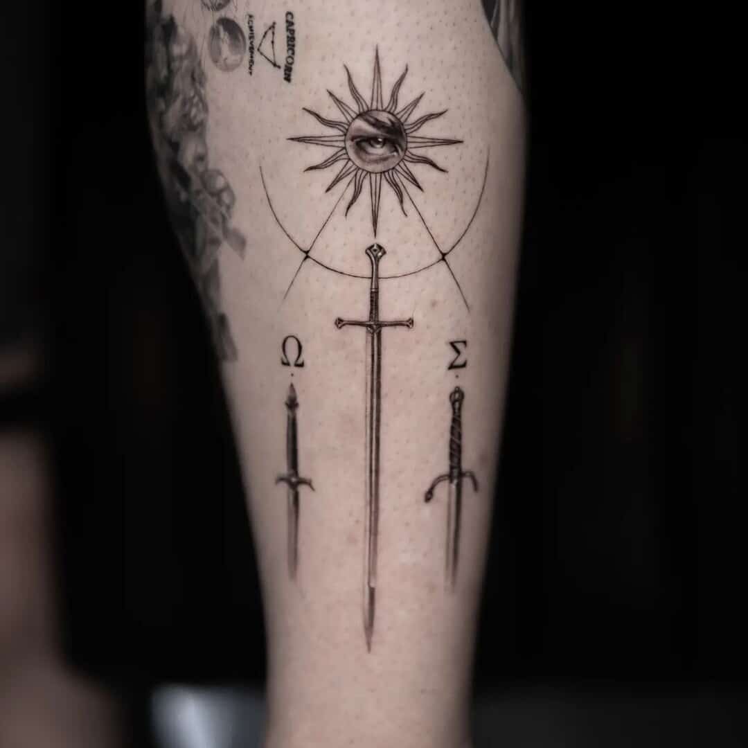 Detailed tattoo design featuring swords and sun symbolism