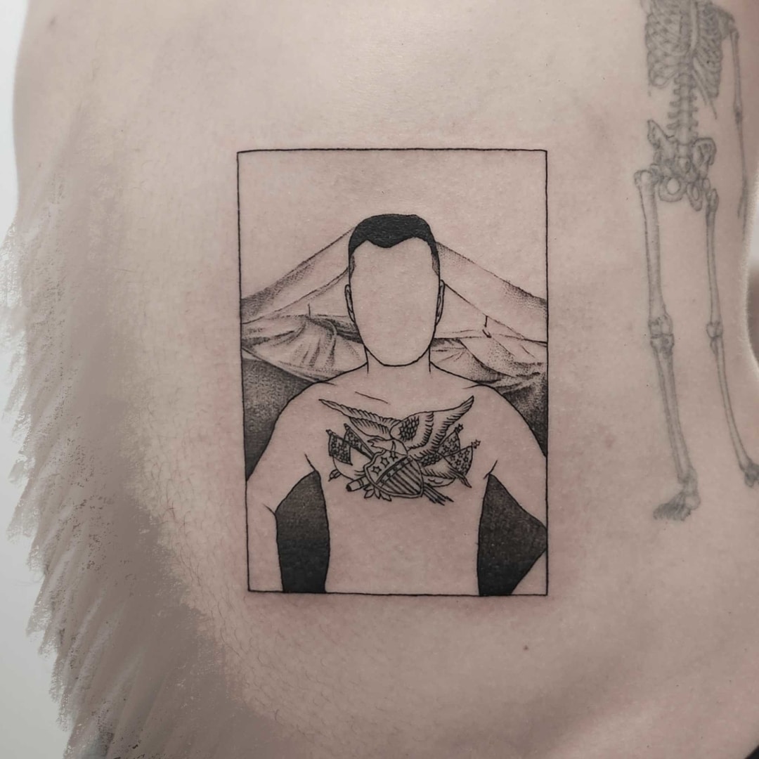 Tattoo art depicting a person with chest tattoo design