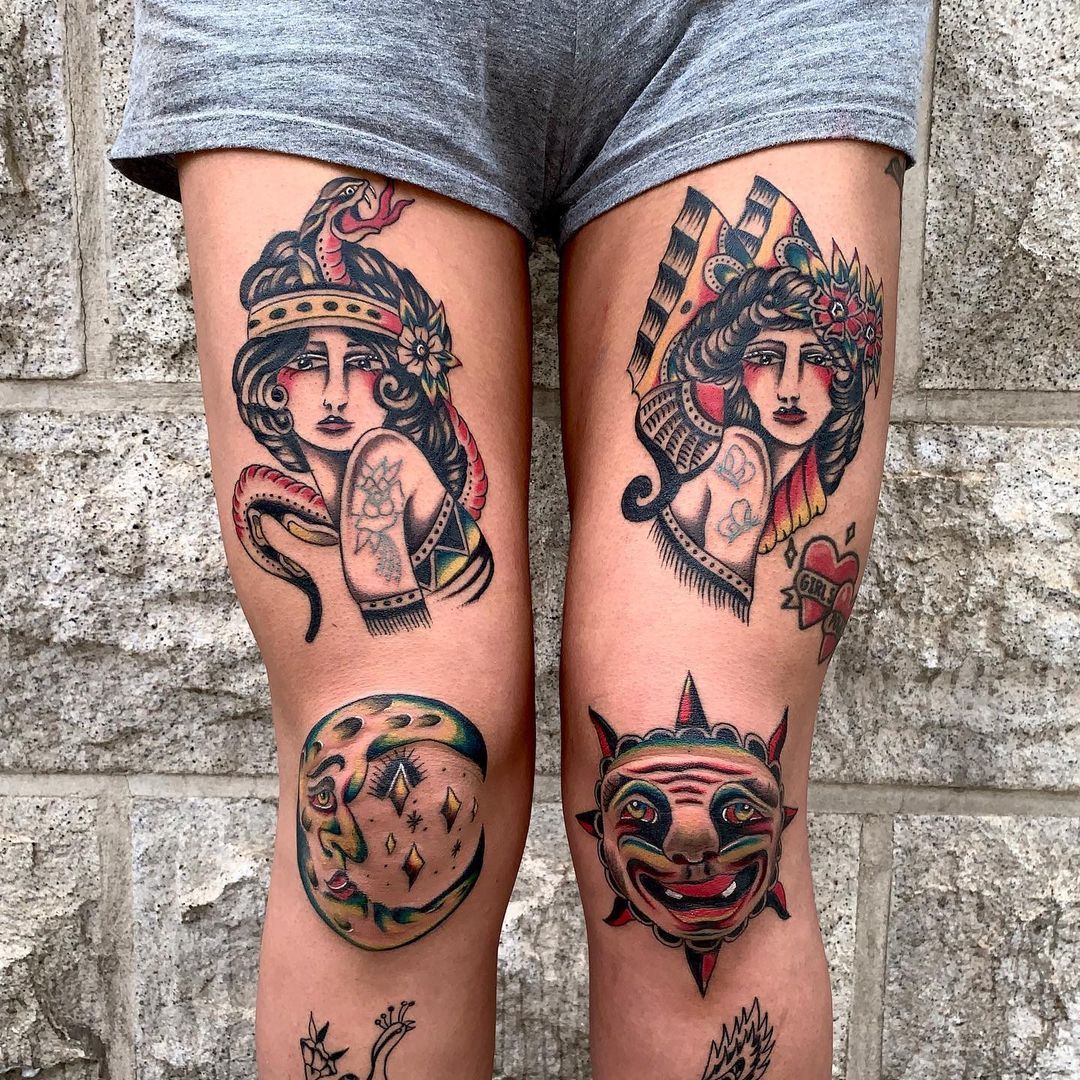 Colorful thigh tattoos featuring female figures, sun, and moon designs.