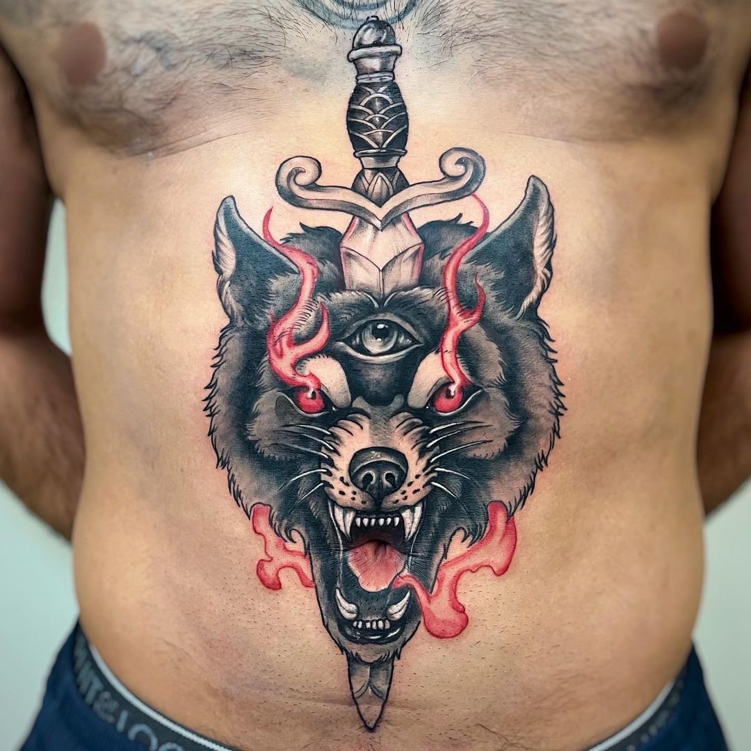 Detailed wolf tattoo design featuring an eye and sword