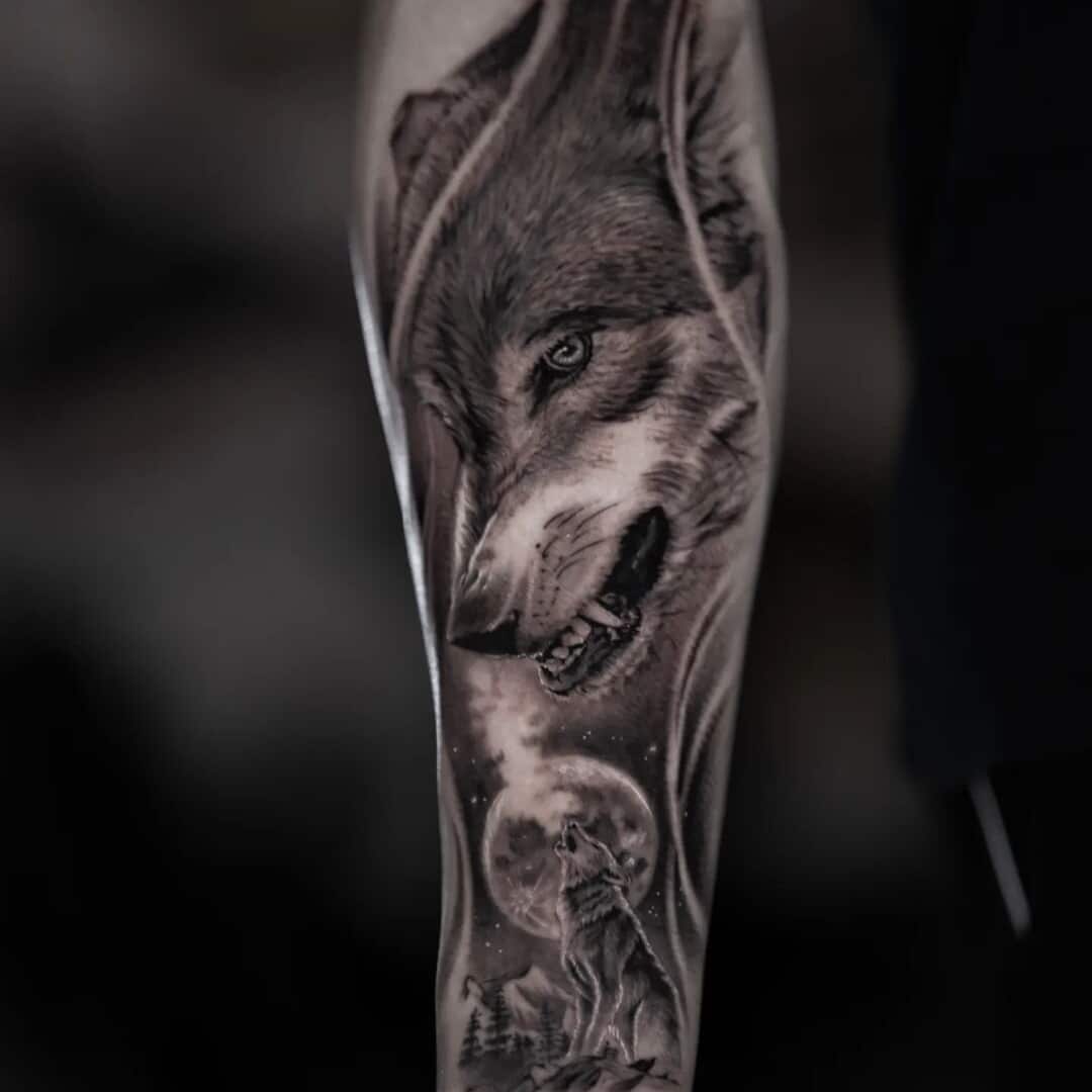 Intricate wolf tattoo design on forearm